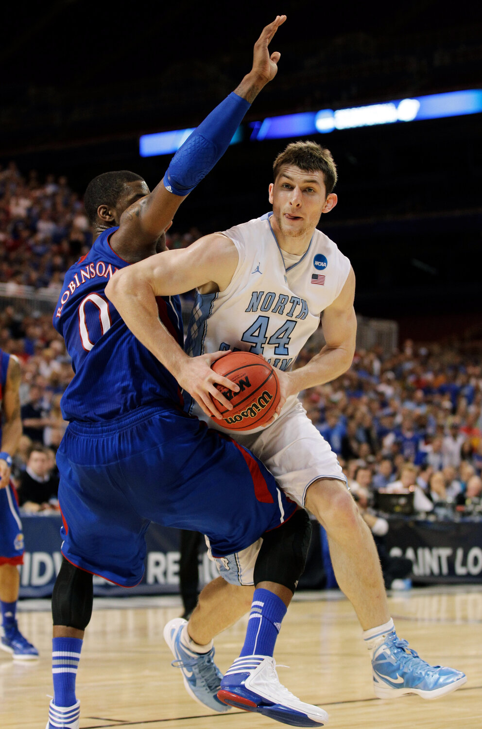 Cutline: Tyler Zeller, battling against Kansas in the NCAA Tournament during his UNC playing days, is in his third season as an assistant at Northwood.